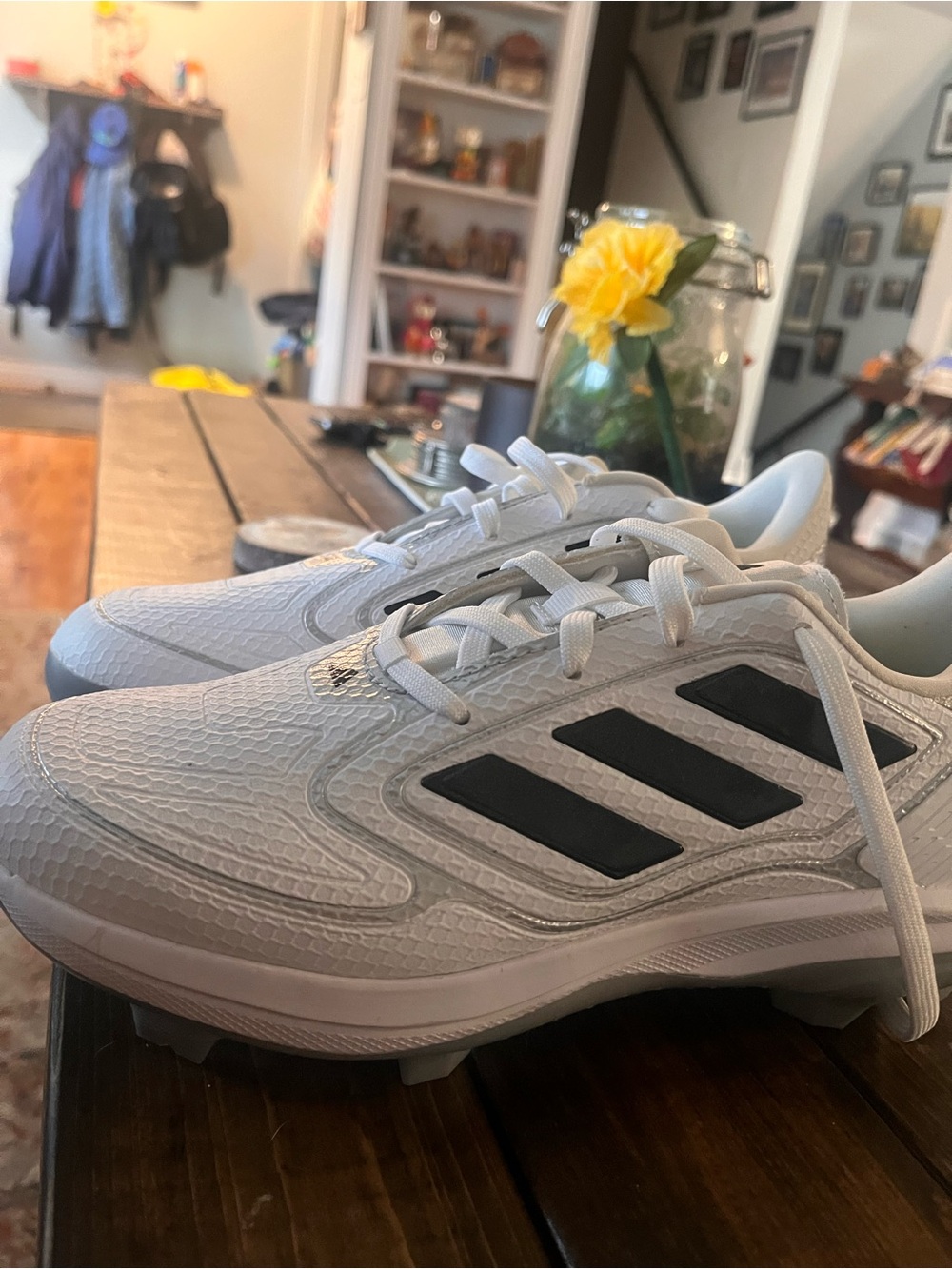 Adidas women’s  White Baseball Cleats with Black Stripes